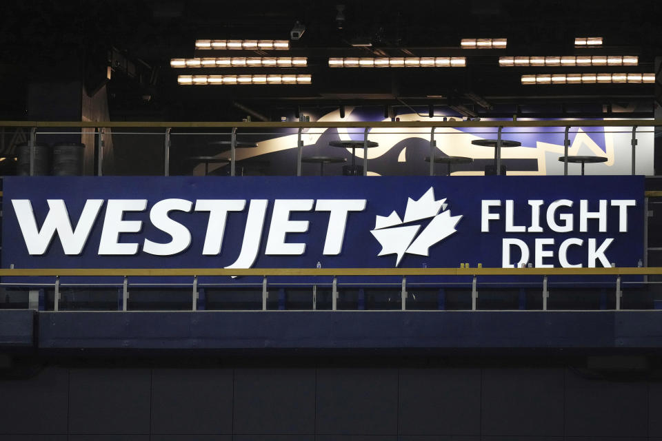 A broken Maple Leaf is shown on a sign after the baseball game between the Toronto Blue Jays and the New York Yankees on Tuesday, May 16, 2023, in Toronto. Yankees' Aaron Judge's two-run home-run ball hit the sign during the eighth inning. (Chris Young/The Canadian Press via AP)