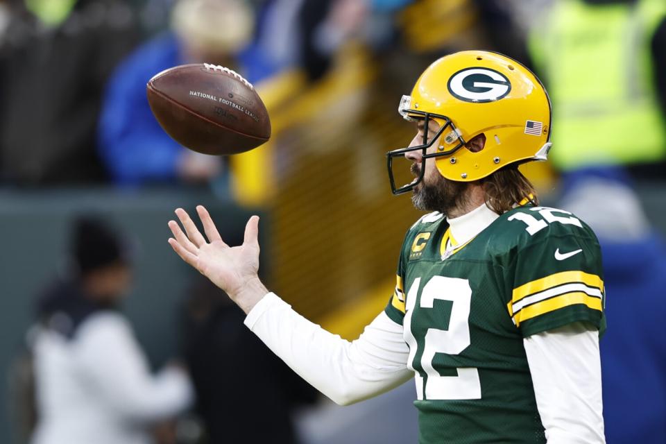 Green Bay Packers quarterback Aaron Rodgers warms up before a game against the Rams on Nov. 28.