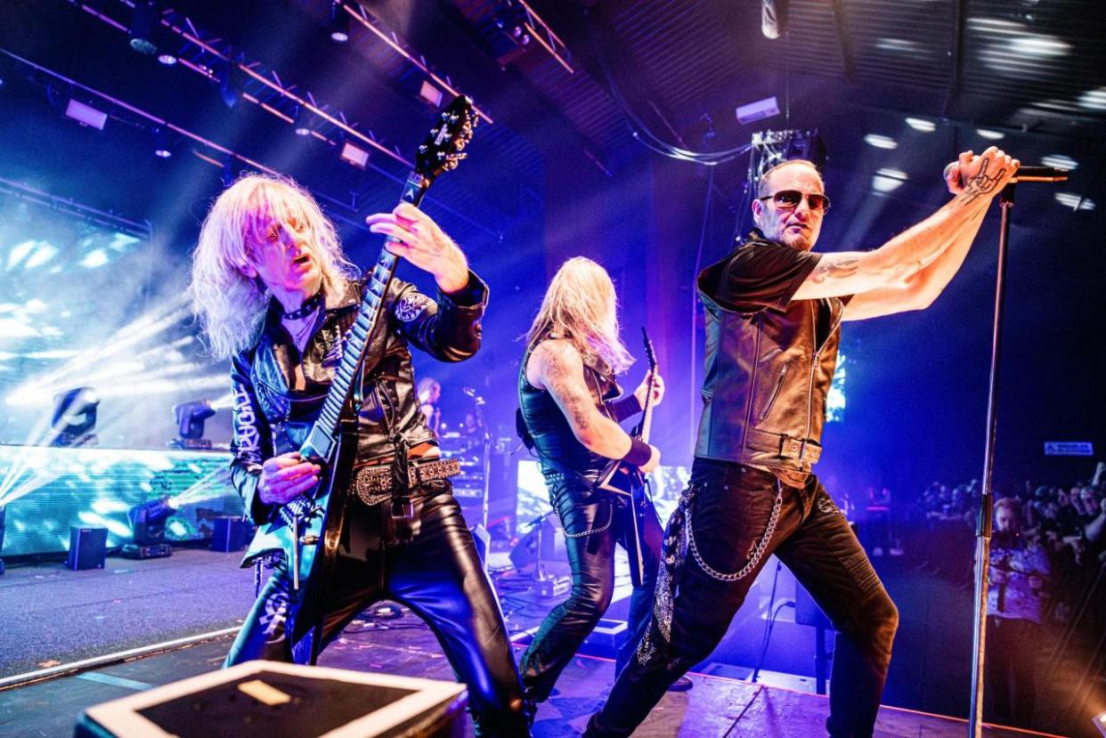 Singer Tim “Ripper” Owens performs with guitarists K.K. Downing and A.J. Mills in KK’s Priest.