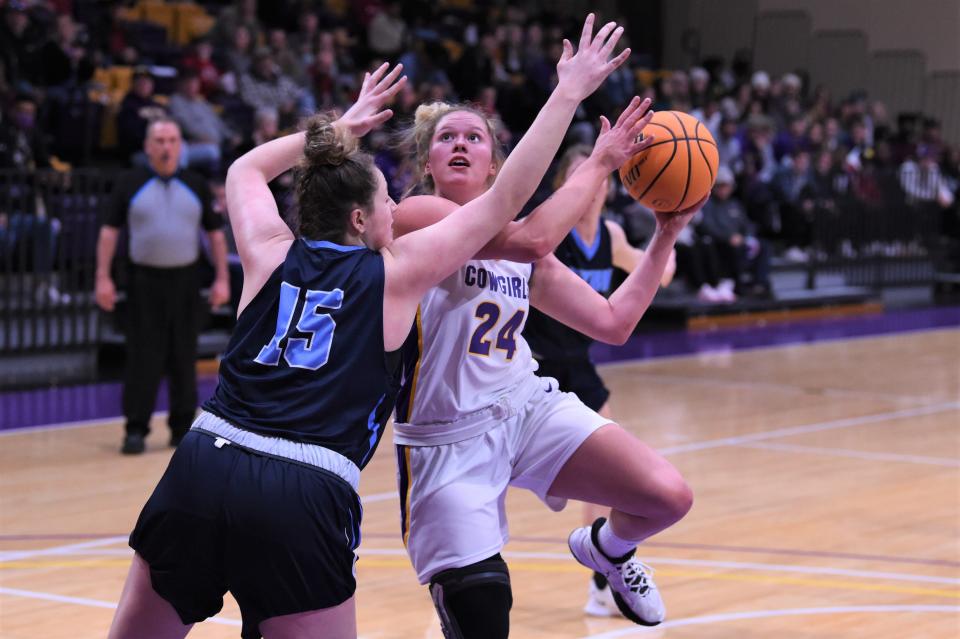 Hardin-Simmons' Kiki Gonzales (24) goes up for a contested shot during Thursday's top 20 matchup against No. 20 East Texas Baptist at the Mabee Complex. Gonzales had 11 points and five rebounds off the bench as the No. 17 Cowgirls fell 56-51.