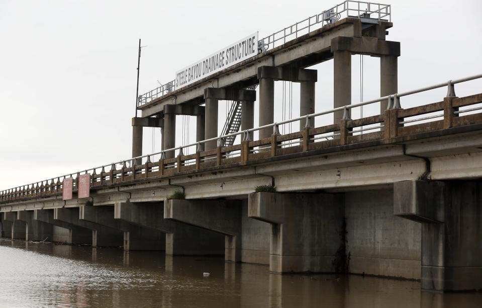 Water from recent rainfalls pool up along the Steele Bayou Drainage Structure on a levee in Warren County, Miss., as shown in this Friday, March 1, 2019 photograph. As Mississippi River backwaters in the Eagle Lake area are at flood level and are projected to rise even higher, it is causing limited access to residents by emergency vehicles. The levee protects thousands of square miles of the Delta region from even worse flooding by the Mississippi River. (AP Photo/Rogelio V. Solis)