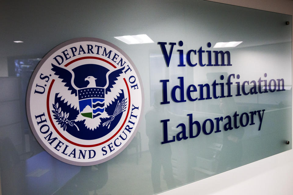 A sign to the Victim Identification Lab, part of Homeland Security's Child Exploitation Investigations Unit, is seen in Fairfax, Va., Friday, Nov. 22, 2019. The Homeland Security Investigations section's little-known Child Exploitation Investigations lab is where agents scour disturbing photos and videos of child sexual abuse. They look for unlikely clues that help them identify the children and bring their abusers to justice. In one case, it was the loud, persistent chirping of a bird. Another time, it was unusual playground equipment. (AP Photo/Jacquelyn Martin)