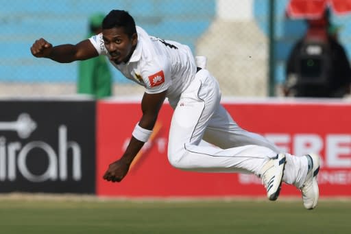 Sri Lanka's Vishwa Fernando bowls on the way to taking two Pakistan wickets in three balls before lunch on the first day of the second Test in Karachi