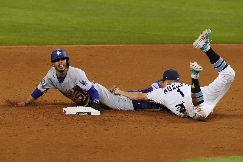 Los Angeles Dodgers' Mookie Betts steals second past Tampa Bay Rays shortstop Willy Adames during the sixth inning in Game 3 of the baseball World Series Friday, Oct. 23, 2020, in Arlington, Texas. (AP Photo/Tony Gutierrez)