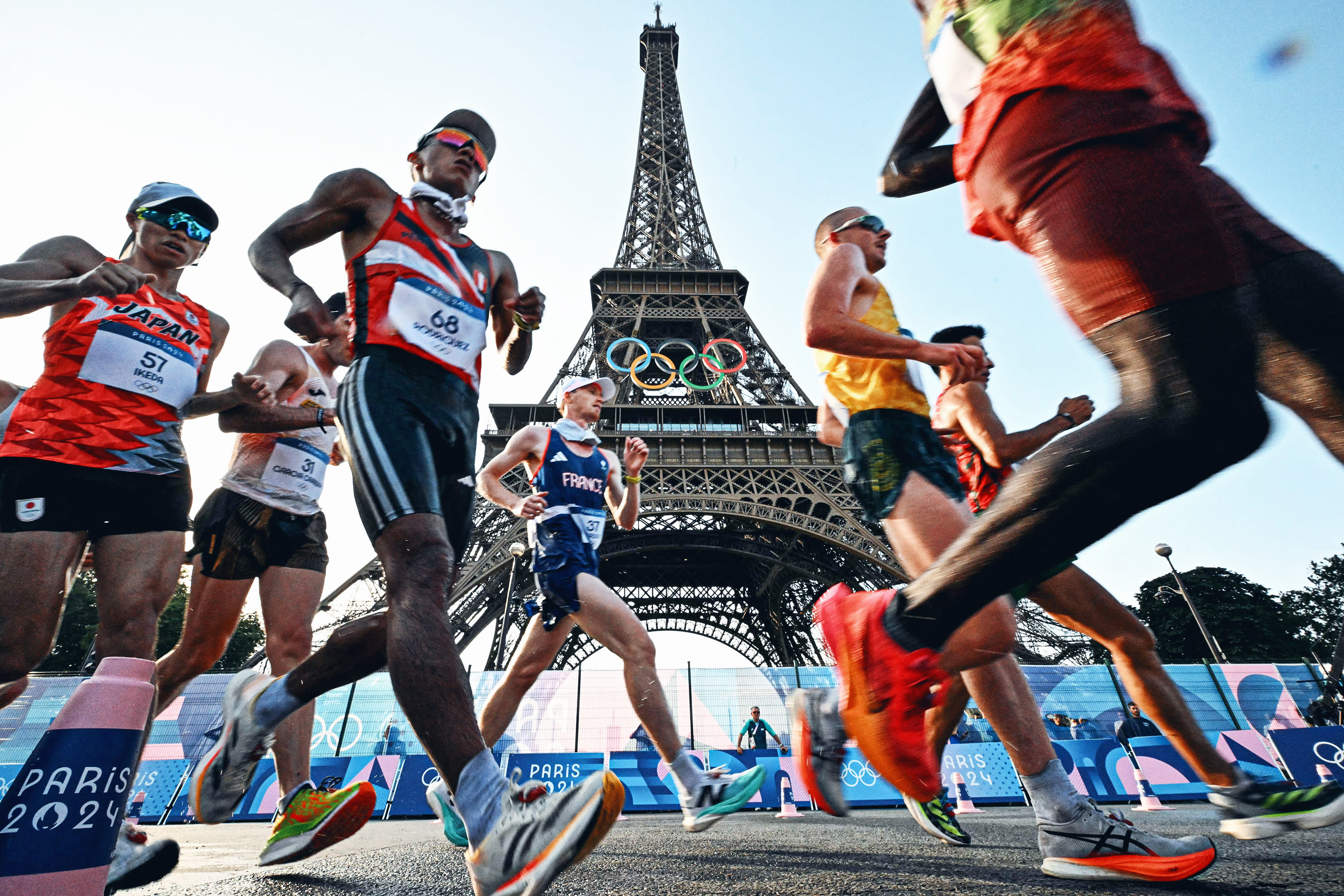 Athletes compete in the men's 20km race walk of the athletics event at the Paris 2024 Olympic Games at Trocadero in Paris on August 1, 2024.  (Photo by LIONEL BONAVENTURE/AFP via Getty Images)