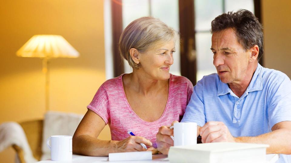 older man and woman having coffee