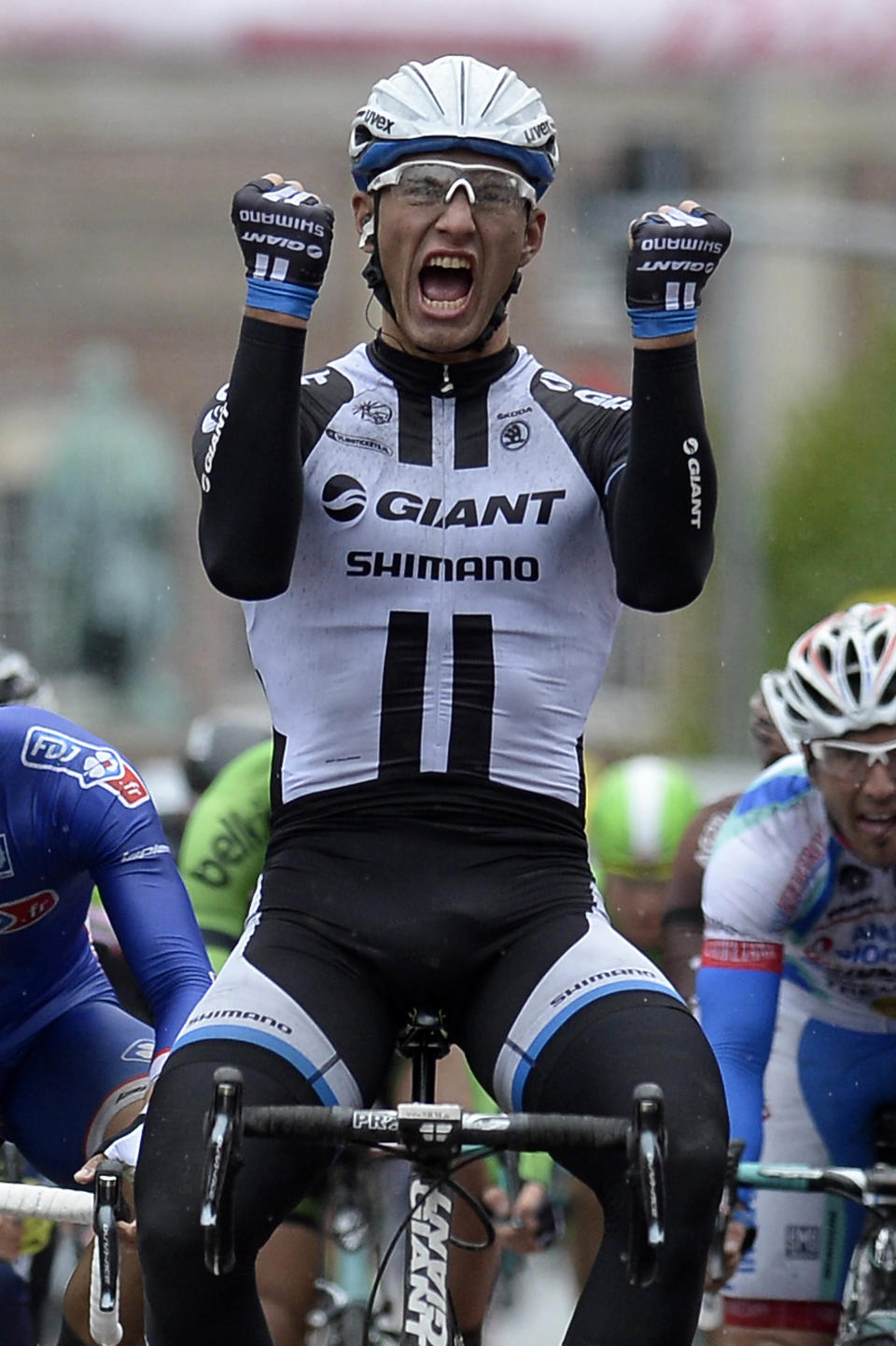 Germany's Marcel Kittel, celebrates as he crosses the finish line to win the 218-kilometer (135-mile) second stage of the Giro d'Italia, Tour of Italy cycling race, from Belfast to Belfast, Northern Ireland, Saturday May 10, 2014. (AP Photo/Fabio Ferrari)