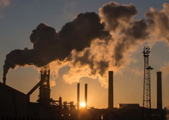 The sun rises above Tata Steel's Scunthorpe Plant in England.