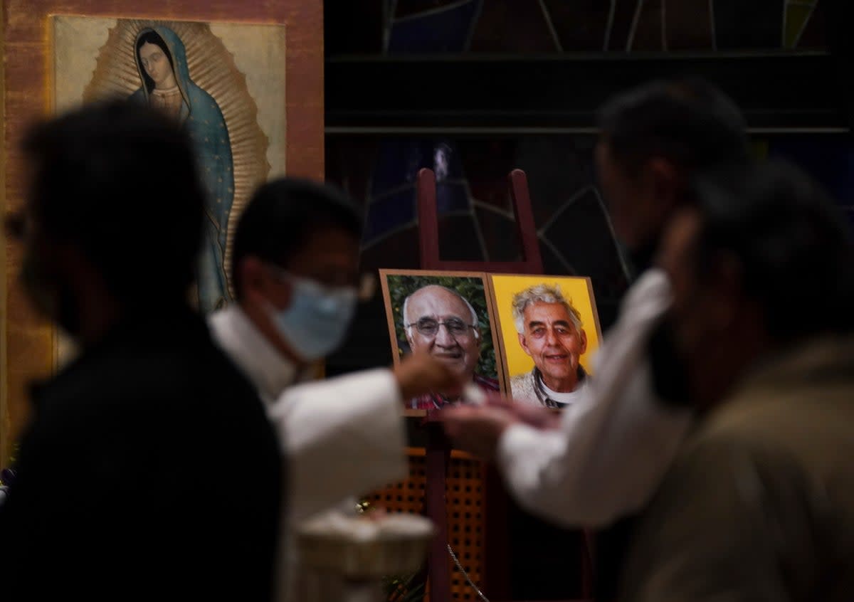 Worshipers in Mexico mourn the deaths of two Jesuit priests  (Associated Press)