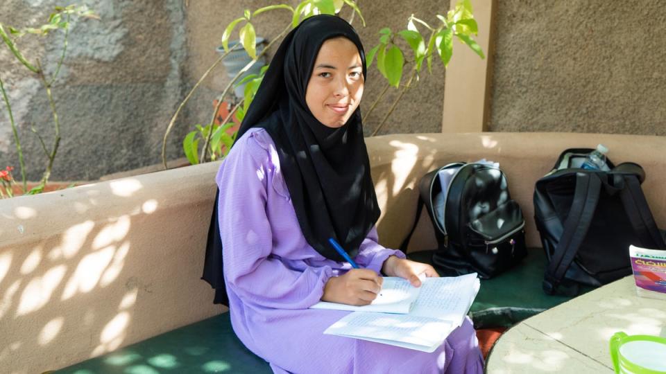 Wafaa Belkaas, 19, studies in the garden of her EFA boarding house in Asni, Morocco (Alex Goldsmith/Evening Standard)