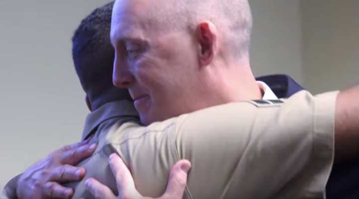 An FBI special agent reunited with a newborn he rescued over two decades ago at his retirement ceremony (Credit: YouTube)