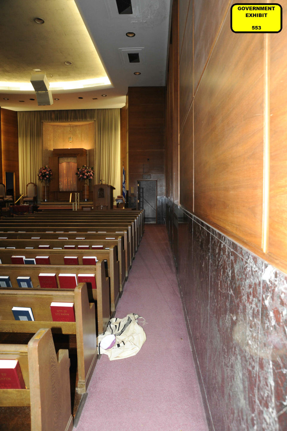 This photo of the Pervin Chapel in the Tree of Life synagogue building in Pittsburgh was entered May 31, 2023, as a court exhibit by prosecutors in the federal trial of Robert Bowers. He faces multiple charges in the killing of 11 worshippers from three congregations and the wounding of seven worshippers and police officers in the building on Oct. 27, 2018. The photo shows a fallen prayer shawl from one of the worshippers who fled the chapel, where Tree of Life Congregation members had been worshipping and where several were killed. The charges include the obstruction of the free exercise of religion, resulting in death. (U.S. District Court for the Western District of Pennsylvania via AP)