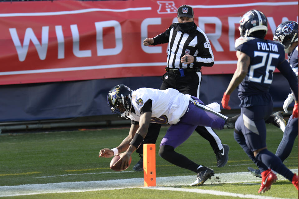 Baltimore Ravens quarterback Lamar Jackson (8) scores a touchdown on a 48-yard run against the Tennessee Titans in the first half of an NFL wild-card playoff football game Sunday, Jan. 10, 2021, in Nashville, Tenn. (AP Photo/Mark Zaleski)