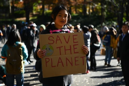 Hundreds marched through Tokyo's teeming Shinjuku district to raise awareness about climate change