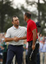 Francesco Molinari of Italy congratulates Tiger Woods of the United States on his win on the 18th green during the final round of the Masters at Augusta National Golf Club on April 14, 2019 in Augusta, Georgia. (Photo by Kevin C. Cox/Getty Images)