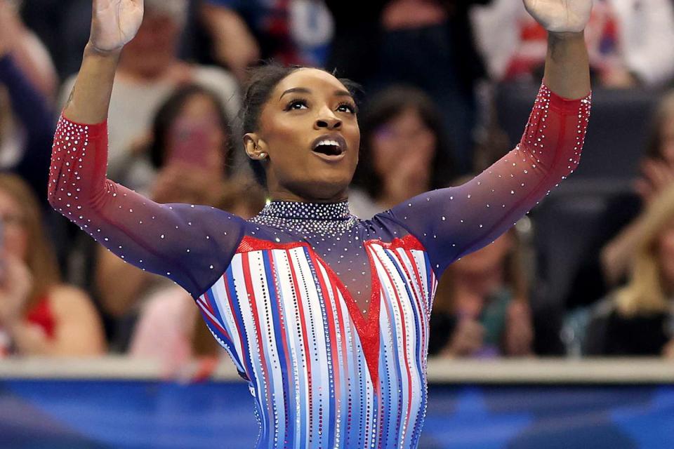 <p>Jamie Squire/Getty</p> Simone Biles reacts after finishing her routine in the floor exercise on Day 4 of the 2024 U.S. Olympic team gymnastics trials on June 30.