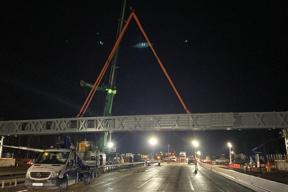 A gantry being installed overnight on a closed section of the M25 motorway in Surrey (National Highways South-East/PA) (PA Media)