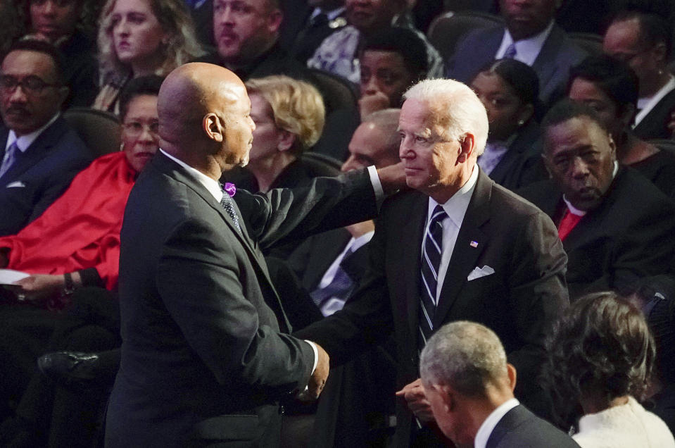 James Cummings, the older brother of the late Rep. Elijah Cummings, D-Md., greets former Vice President Joe Biden during the funeral service at the New Psalmist Baptist Church in Baltimore, Md., on Friday, Oct. 25, 2019. (Joshua Roberts/Pool via AP)