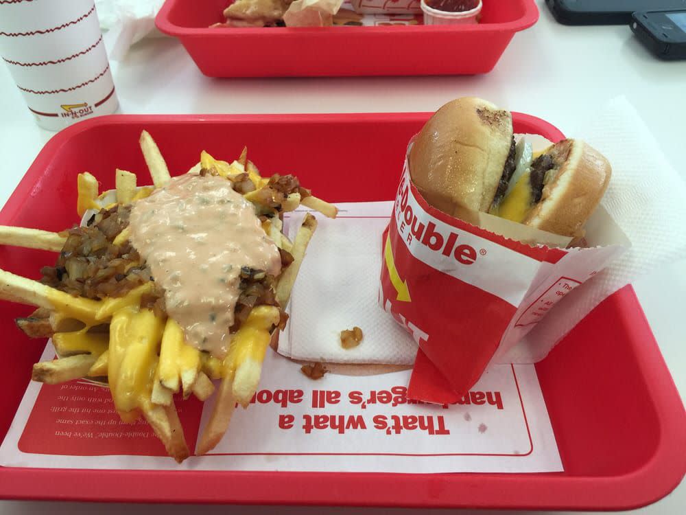 Monkey-Style Burger is made combining a cheeseburger with animal-style fries.