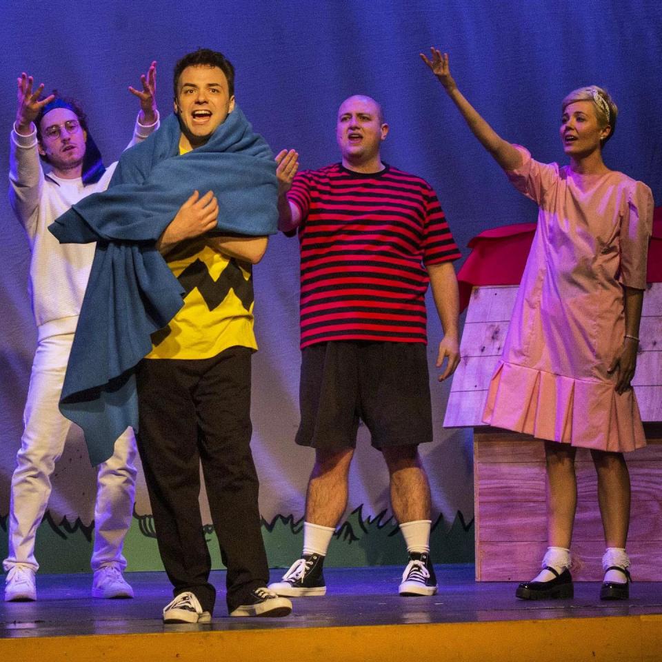 From left, Reilly Callaghan as Snoopy, Brett J. Young as Charlie Brown, Zeb Mims as Linus and Amy Carter as Sally in Pineapple-Shaped Lamps' production of "You're a Good Man, Charlie Brown."