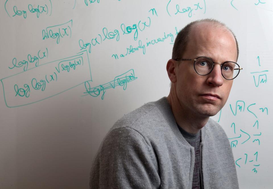 nick bostrom at work, whiteboard in background