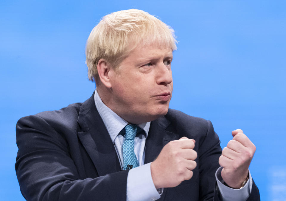 Prime Minister Boris Johnson delivering his speech at the Conservative Party Conference at the Manchester Convention Centre. (Photo by Danny Lawson/PA Images via Getty Images)