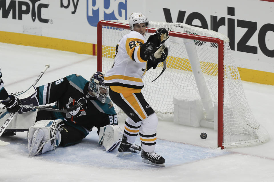 Pittsburgh Penguins' Sidney Crosby (87) celebrates as a shot by Evgeni Malkin gets by Anaheim Ducks goaltender John Gibson (36) for a goal during the first period of an NHL hockey game, Monday, Dec. 17, 2018, in Pittsburgh. (AP Photo/Keith Srakocic)