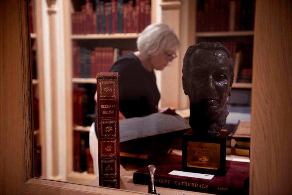 Librarian Betse Gori works in the locked room of rare books and special collections, including Addison Mizner personal library at the Society of the Four Arts King Library in August.