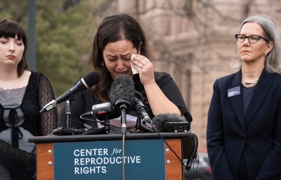 Anna Zargarian, one of five plaintiffs a lawsuit against Texas abortion laws, speaks in front of the state capitol in Austin, Texas on 7 March. (AP)