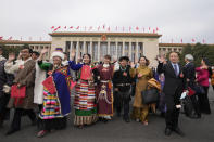 FILE- Ethnic minority delegates leave after the closing ceremony for China's National People's Congress (NPC) at the Great Hall of the People in Beijing, Monday, March 13, 2023. The National People's Congress is largely ceremonial in that it doesn't have any real power to decide on legislation. The deputies do vote, but it's become a unanimous or near-unanimous formalizing of decisions that have been made by Communist Party leaders behind closed doors. (AP Photo/Andy Wong, File)