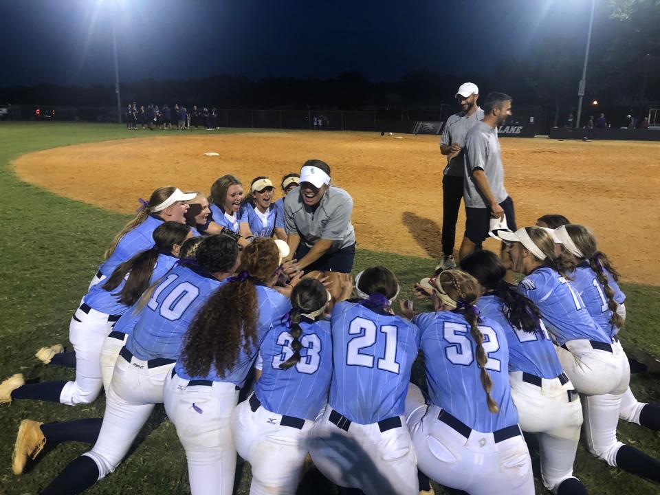 South Lake softball coach Kahley Armstong celebrates with her players Thursday after the Eagles beat New Port Richey River Ridge 4-2 in the Class 5A-Region 2 championship game at the Eagles Nest in Groveland. With the win, South Lake advances into next week's FHSAA state semifinals at Legends Way Ballfields in Clermont.