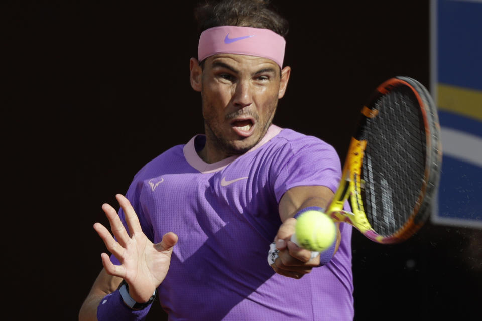 Spain's Rafael Nadal returns the ball to United States' Reiley Opelka during their semi-final match at the Italian Open tennis tournament, in Rome, Saturday, May 15, 2021. (AP Photo/Gregorio Borgia)