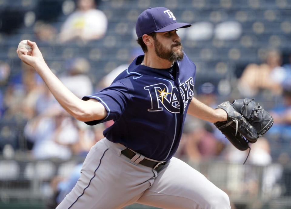 FILE - Tampa Bay Rays relief pitcher Ryan Thompson throws in the sixth inning against the Kansas City Royals during a baseball game July 24, 2022, in Kansas City, Mo. Thompson went to arbitration with the Rays on Monday, Feb. 6, 2023, while Miami's Jon Berti reached a deal with the Marlins for $2,125,000 that avoided a hearing. (AP Photo/Ed Zurga, File)