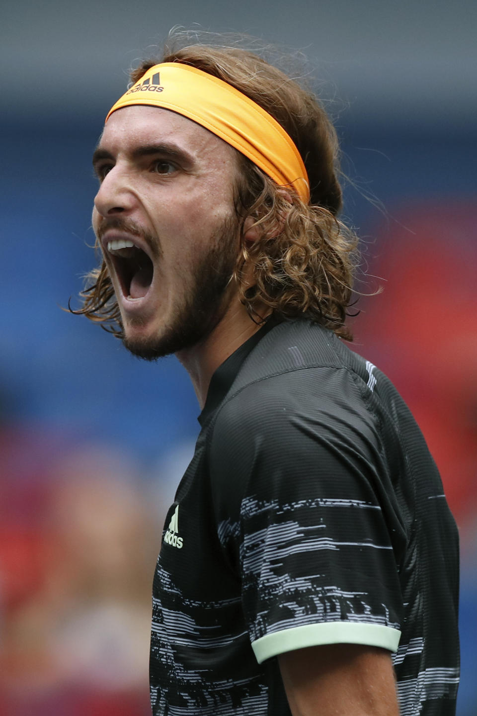Stefanos Tsitsipas of Greece shouts after defeating Felix Auger-Aliassime of Canada in the men's singles match at the Shanghai Masters tennis tournament at Qizhong Forest Sports City Tennis Center in Shanghai, China, Wednesday, Oct. 9, 2019. (AP Photo/Andy Wong)
