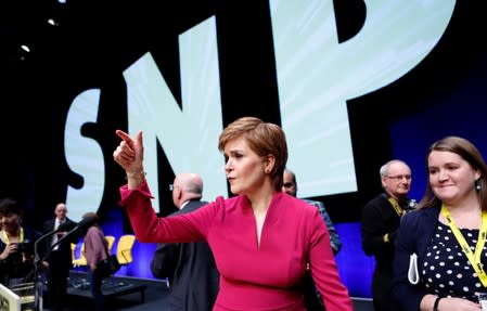 Scotland's First Minister Nicola Sturgeon reacts with the delegates following her speech at the SNP autumn conference in Aberdeen, Scotland