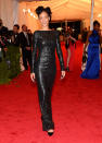 <p class="MsoNoSpacing">Rihanna was rather tame in long-sleeved black textured gown designed by Tom Ford, which featured a low-cut back.</p>