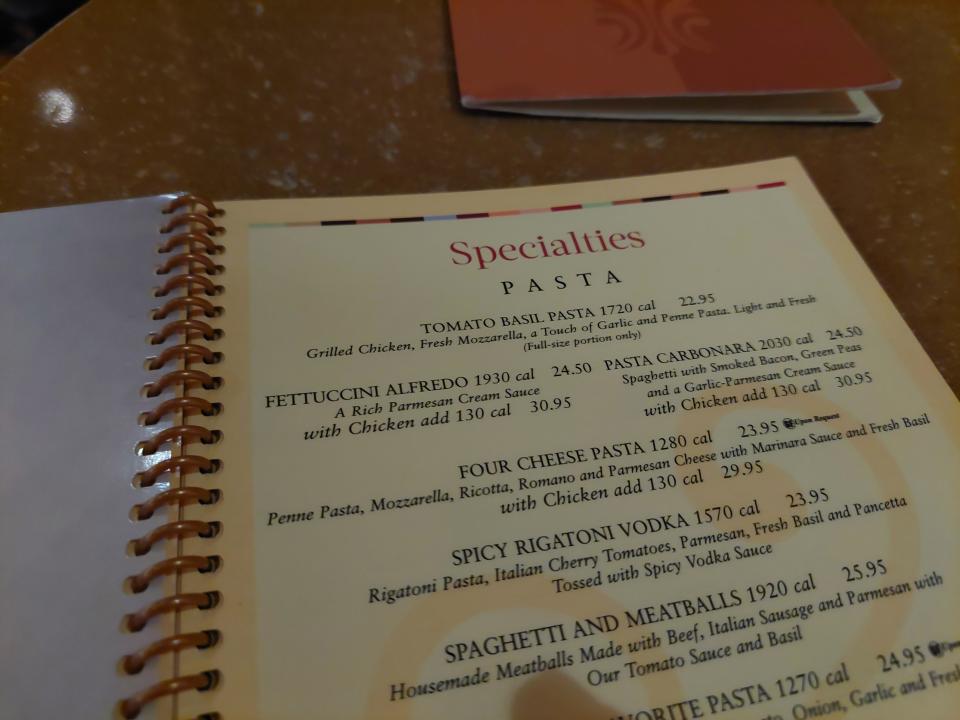 A photo of the Cheesecake Factory's menu. The page is open on pasta