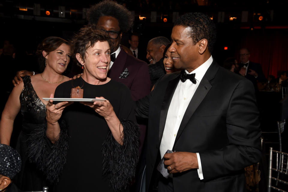 HOLLYWOOD, CALIFORNIA - JUNE 06: (L-R) Melissa Bell, Frances McDormand, W. Kamau Bell and Denzel Washington attend the 47th AFI Life Achievement Award honoring Denzel Washington at Dolby Theatre on June 06, 2019 in Hollywood, California. (Photo by Michael Kovac/Getty Images for AFI)