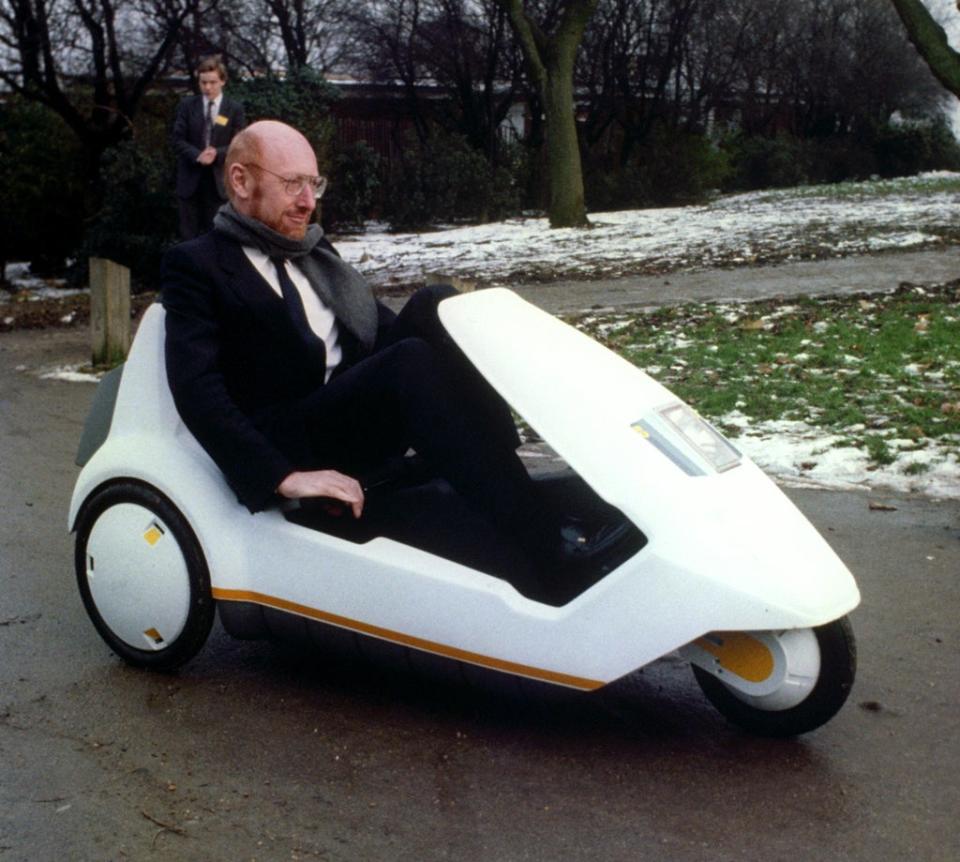 Inventor Sir Clive Sinclair demonstrates his battery-assisted pedal-powered tricycle (PA) (PA Archive)