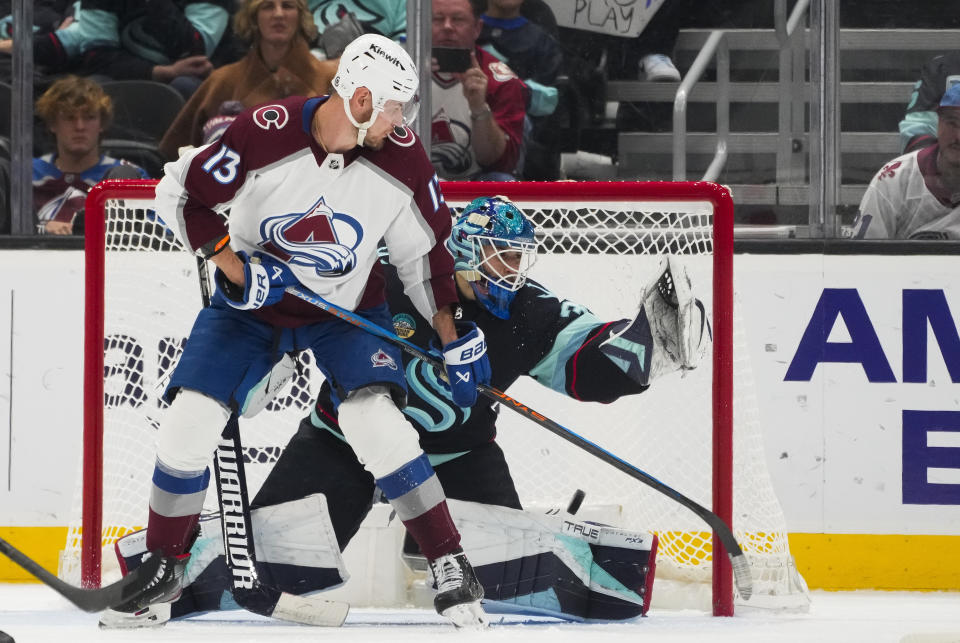 Colorado Avalanche right wing Valeri Nichushkin (13) redirects the puck for a backhanded goal against Seattle Kraken goaltender Joey Daccord during the third period of an NHL hockey game, Monday, Nov. 13, 2023, in Seattle. The Avalanche won 5-1. (AP Photo/Lindsey Wasson)