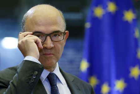 European Economic and Financial Affairs, Taxation and Customs Union Commissioner-designate Pierre Moscovici of France adjusts his glasses as he attends his hearing before the European Parliament's Committee on Economic and Monetary Affairs at the EU Parliament in Brussels October 2, 2014. REUTERS/Francois Lenoir