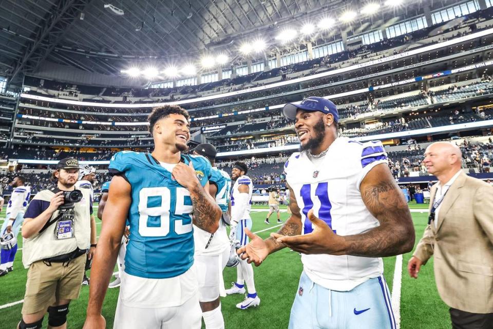Jacksonville Jaguars tight end Brenton Strange (85) speaks with Dallas Cowboys pass rusher Micah Parsons (11) after the first preseason game between the Dallas Cowboys and Jacksonville Jaguars at AT&T Stadium in Arlington, Texas on Saturday, Aug. 12, 2023. Chris Torres/ctorres@star-telegram.com