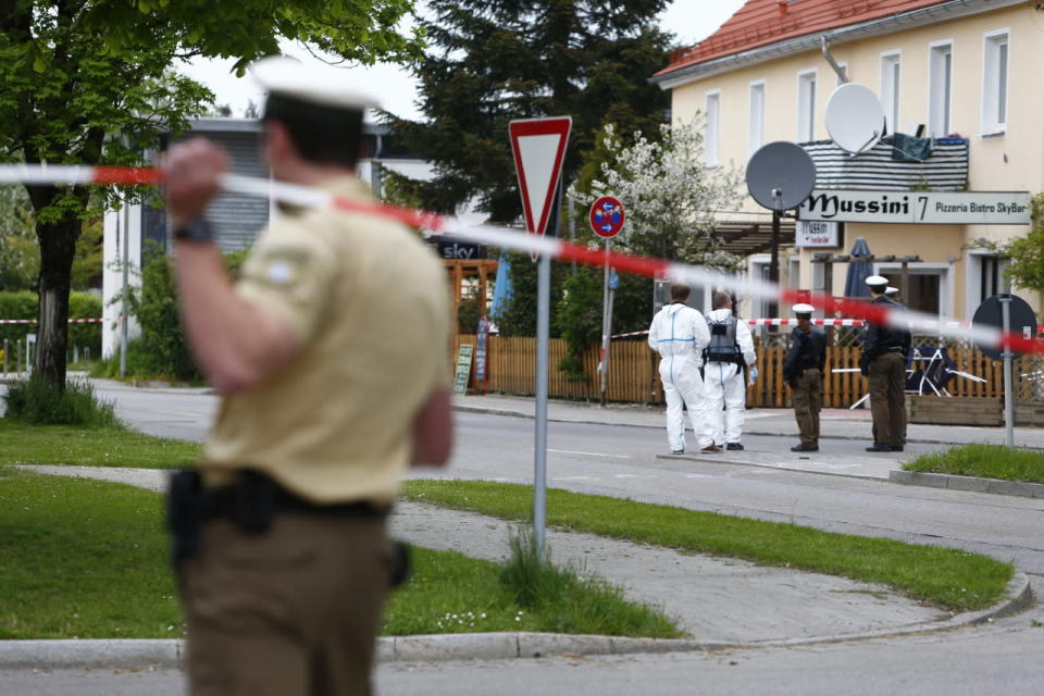 Police officers are pictured at the train station in Grafing, Germany, May 10, 2016. (REUTERS/Michaela Rehle)