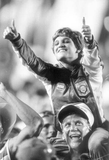 Gymnastics gold medal winner Mary Lou Retton participates in closing ceremonies of the 1984 Olympic Games.