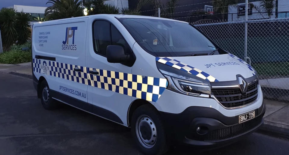 The JPT Services van with its blue and white chequered pattern. 