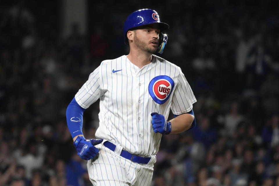 Chicago Cubs' Trey Mancini runs to first base after hitting a one-run single during the fifth inning of a baseball game against the Seattle Mariners in Chicago, Tuesday, April 11, 2023. (AP Photo/Nam Y. Huh)