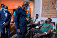 In this photo released by the Lagos State government press, governor Babajide Sanwo-Olu, centre, visit victims injured in last night's protests in a hospital in Lagos, Nigeria, Wednesday Oct. 21, 2020. Nigerians protesting against police brutality stayed on the streets in Lagos on Wednesday, breaking the government curfew following a night of chaotic violence in which demonstrators were fired upon, sparking global outrage. (Lagos State government press Via AP)