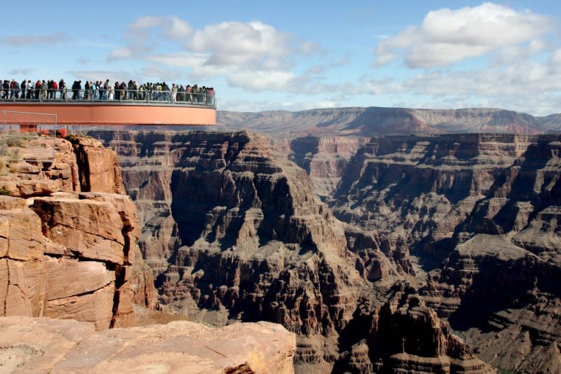 Visitors can be seen on the Skywalk with the Grand Canyon below at the opening of the Grand Canyon Skywalk at Grand Canyon West, Arizona March 28, 2007. On February 26, 1919, 37 years after the first bill to establish the Grand Canyon as a national park was introduced, President Woodrow Wilson signed the Grand Canyon National Park Act, bringing the landmark under the protection of the National Park Service, preserving it for future generations. File Photo by Art Foxall/UPI