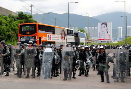 Riot police gather outside Hong Kong International Airport