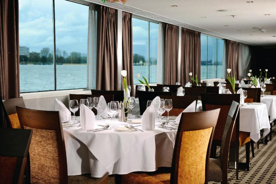 This undated image released by Avalon Waterways shows the dining room on the river ship Avalon Felicity. The small scale of river ships, which typically carry no more than a couple hundred passengers, is a large part of their appeal, in contrast to ocean-going mega-ships that carry thousands. On a river ship, you don’t need a GPS device to figure out where the lobby or the dining room is. And there’s a sense of intimacy, with plenty of cozy moments. (AP Photo/Avalon Waterways, John Amatucci)